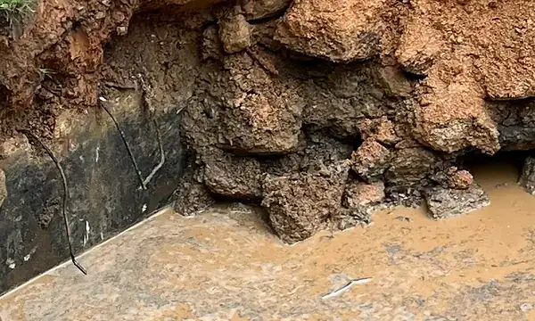 Drainage and erosion correction work for an Alabama clay soil article