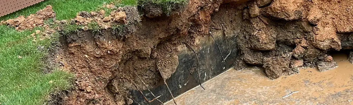 Grade transition and drainage work on an Alabama residential property