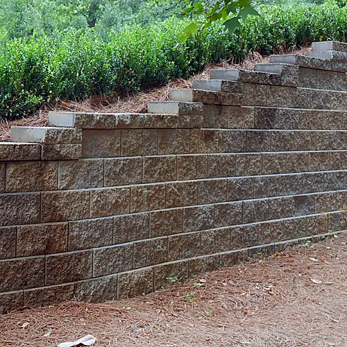 Stepped retaining wall with planting above
