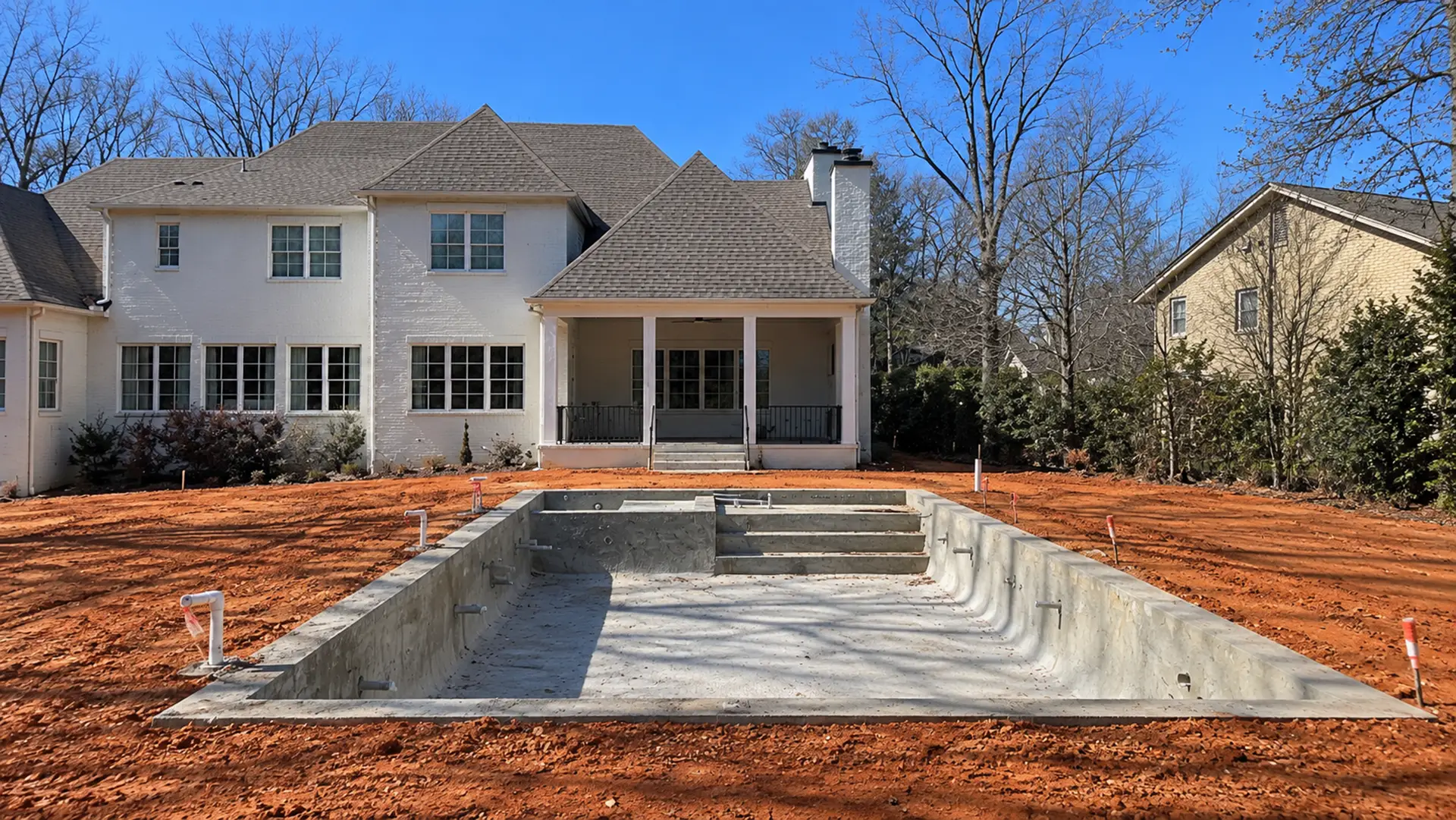 Pool shell and unfinished backyard before the completed Northport redesign