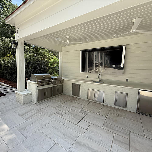 Countertops and storage beneath the covered kitchen