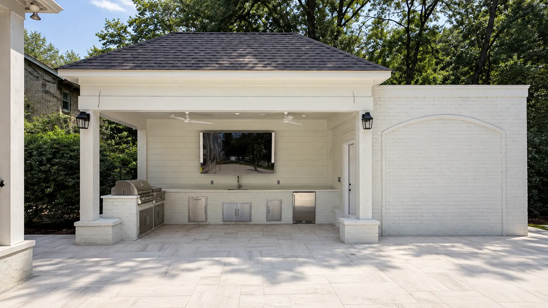 Completed covered outdoor kitchen and limestone terrace