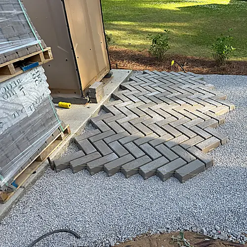 Paver installation detailing and circulation path near the home