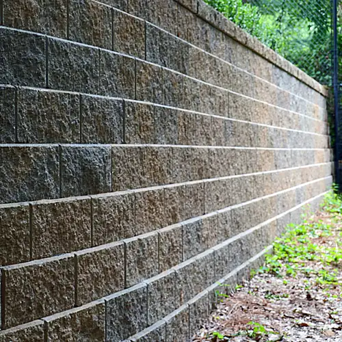 Curving GeoStone retaining wall along the property edge
