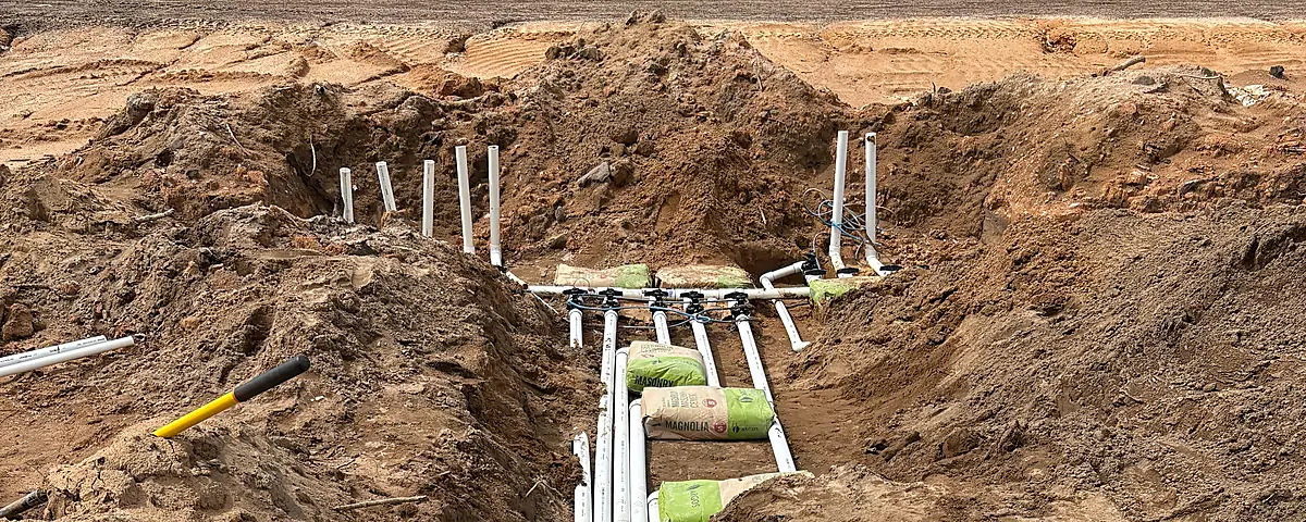 Finished site surfaces preserved by integrated water management