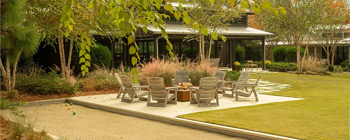 Outdoor living room with covered seating and architectural hardscape