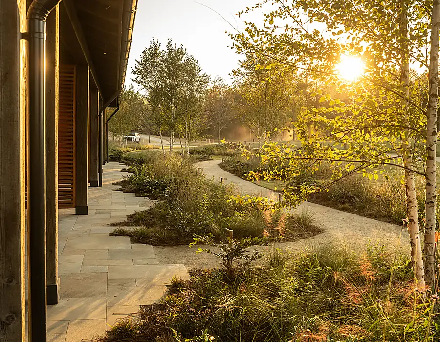 Paved outdoor room connecting hardscape and gathering space